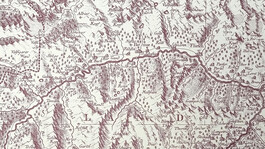 Historische Landkarte mit Gebirgszügen und Ortsnamen entlang des Arlbergs, in braunem Druck.