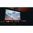 Bühne mit Vortrag und großem Alpenpanorama bei einem Filmfestival / Stage with presentation and large alpine panorama at a film festival