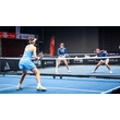 Drei Frauen spielen ein spannendes Pickleball-Doppelmatch in einer modernen Halle mit blauen Spielfeldern / Three women are playing a thrilling pickleball doubles match in a modern indoor venue with blue courts