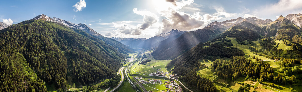 Panorama shot of the St. Anton am Arlberg region in summer with dynamic lighting conditions in the magnificent mountain world