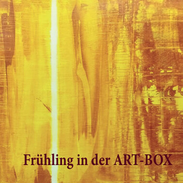 Spring in the ART BOX Sujet. Orange painting with black font in front.