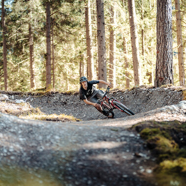 A mountain biker takes a steep bend at the Seelenzoll Trail Park