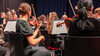 Geigerinnen im Orchester / Violinists in the orchestra Geigerinnen im Orchester während des Konzerts / Violinists performing during the concert
