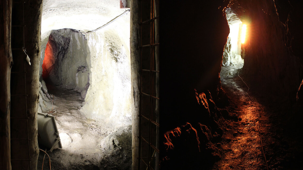 Blick aus einem historischen Bergwerksstollen mit Lichtreflexionen im Wasser. / View from a historic mining tunnel with light reflections in the water.