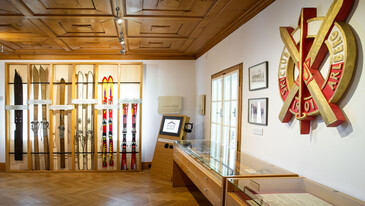 Inside the Museum St. Anton, historic ski equipment, Ski-Club Arlberg Logo and vintage pictures