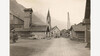 Historischer Ortskern Schnann / Historic village center Schnann Alte Aufnahme mit Blick auf das Feuerwehrhaus und die Kirche von Schnann, flankiert von traditionellen Holzhäusern / Old photograph showing Schnann’s fire station and church, surrounded by traditional wooden houses