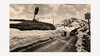 Straßenöffnung Arlbergpass / Arlberg Pass Road Clearance Freigeräumte Straße über den verschneiten Arlbergpass mit hohen Schneewänden und Verkehrsschild / Cleared road over the snow-covered Arlberg pass with high snow walls and traffic sign