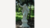 Tiroler Hiasl Denkmal / Tyrolean Hiasl Monument Steinerne Statue eines Mannes mit erhobenem Arm in einem schattigen Park / Stone statue of a man with raised arm in a shaded park